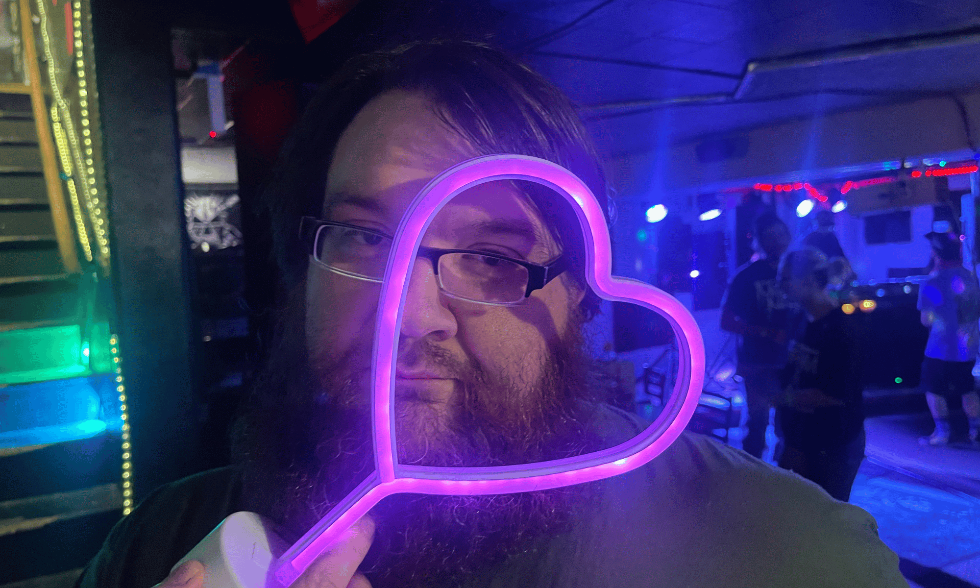 Soirée d'Amour attendee with neon heart